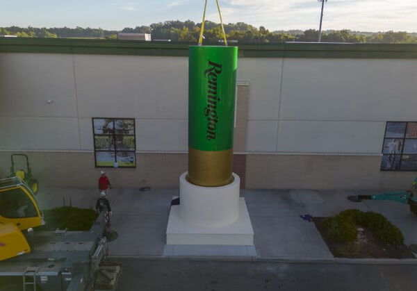 Remington Big Green Shotshell in front of the factory